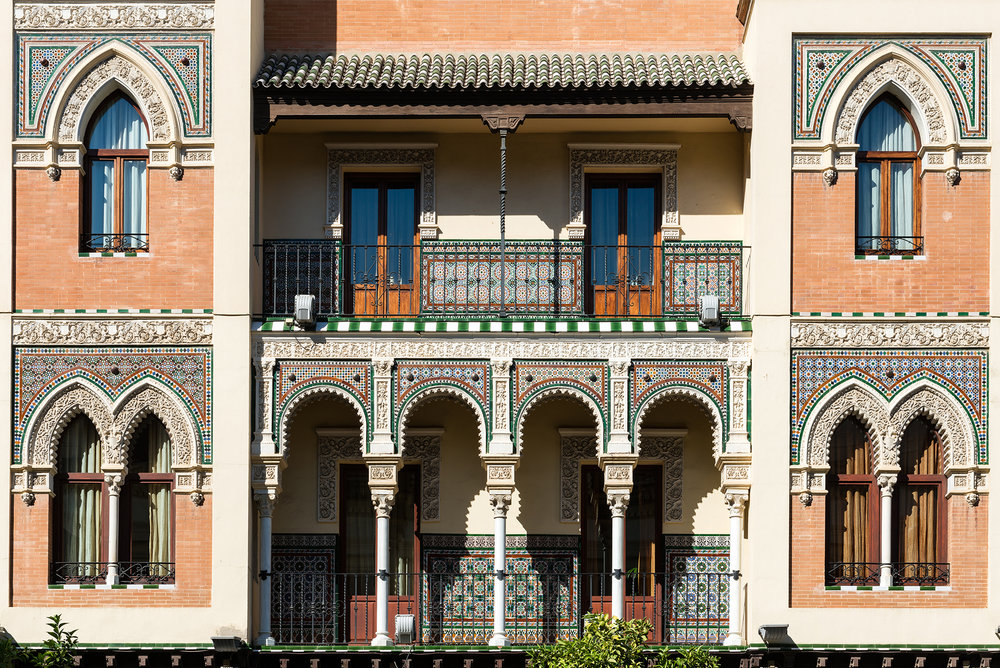 Front neo-mudejar facade of a traditional house in Seville