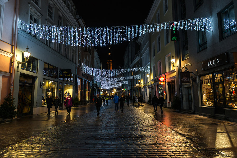 Illuminated Viru Gate and street in the old town