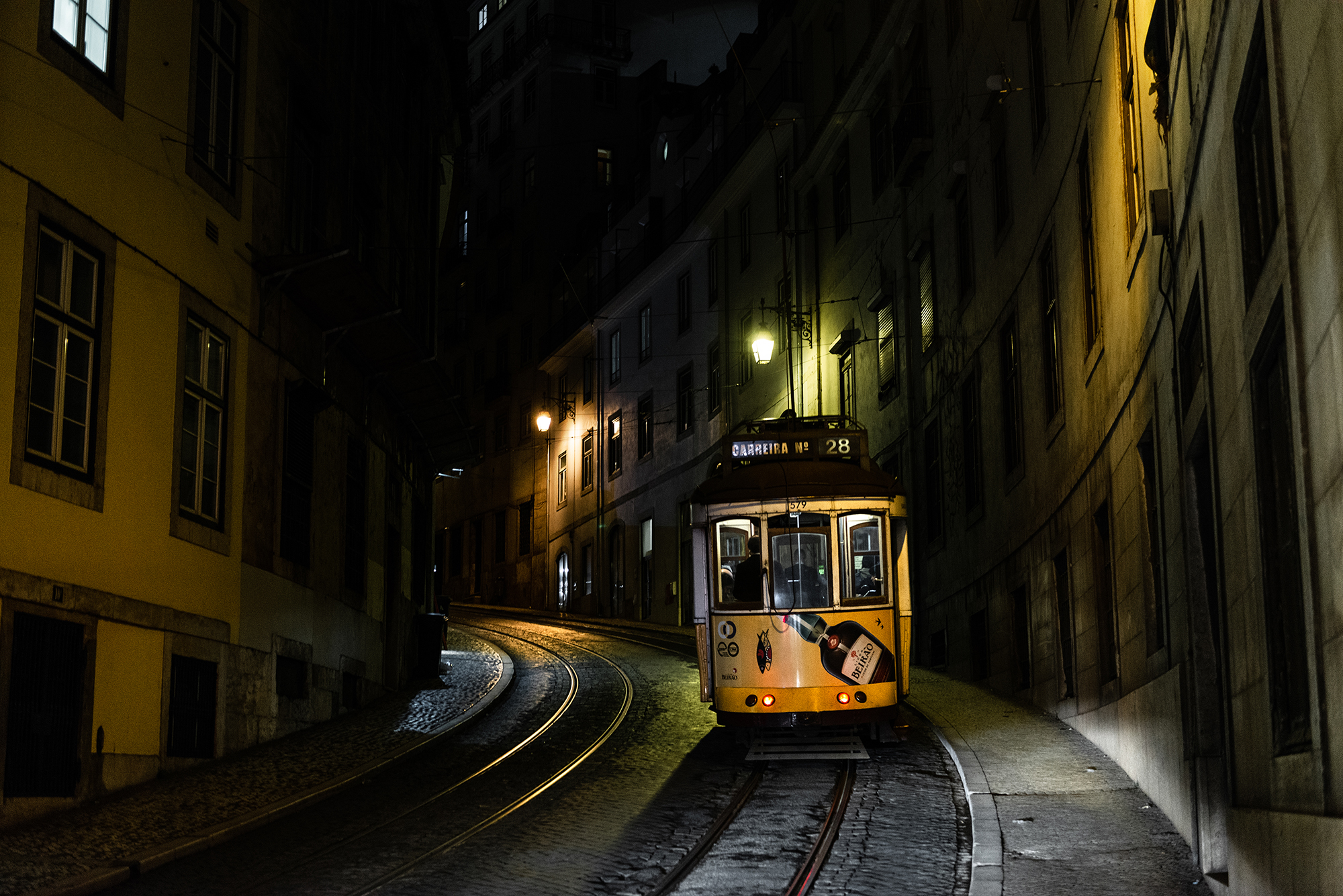 Yellow tram in Lisbon at night