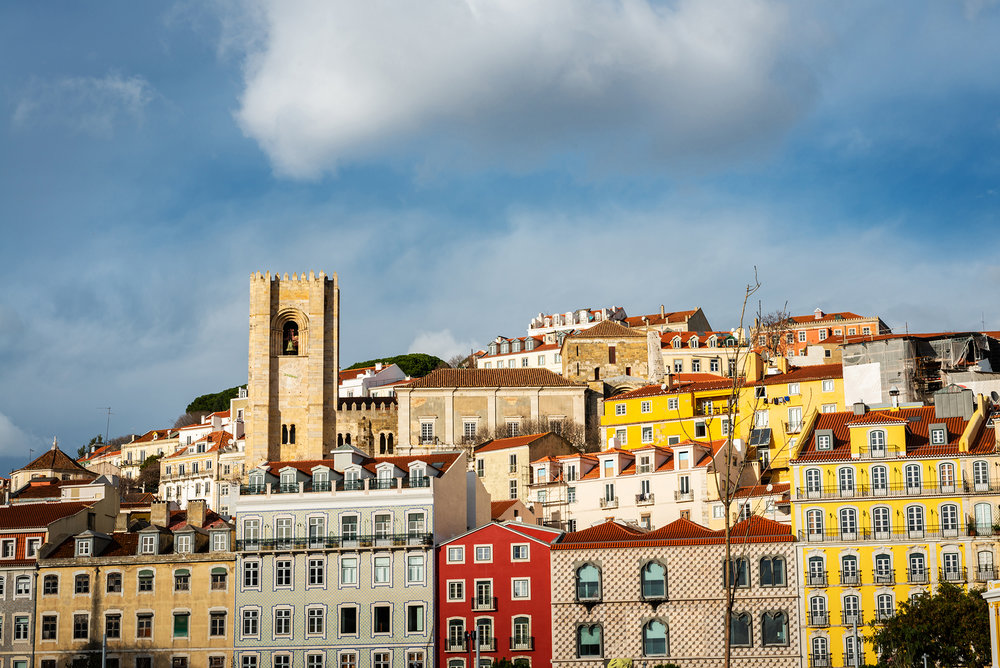 Skyline with the towers of the cathedral and colourful houses of the Alfama district