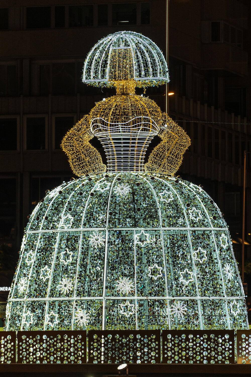 Close-up of a giant light Menina in the Plaza de Colon square in Madrid during Christmas.