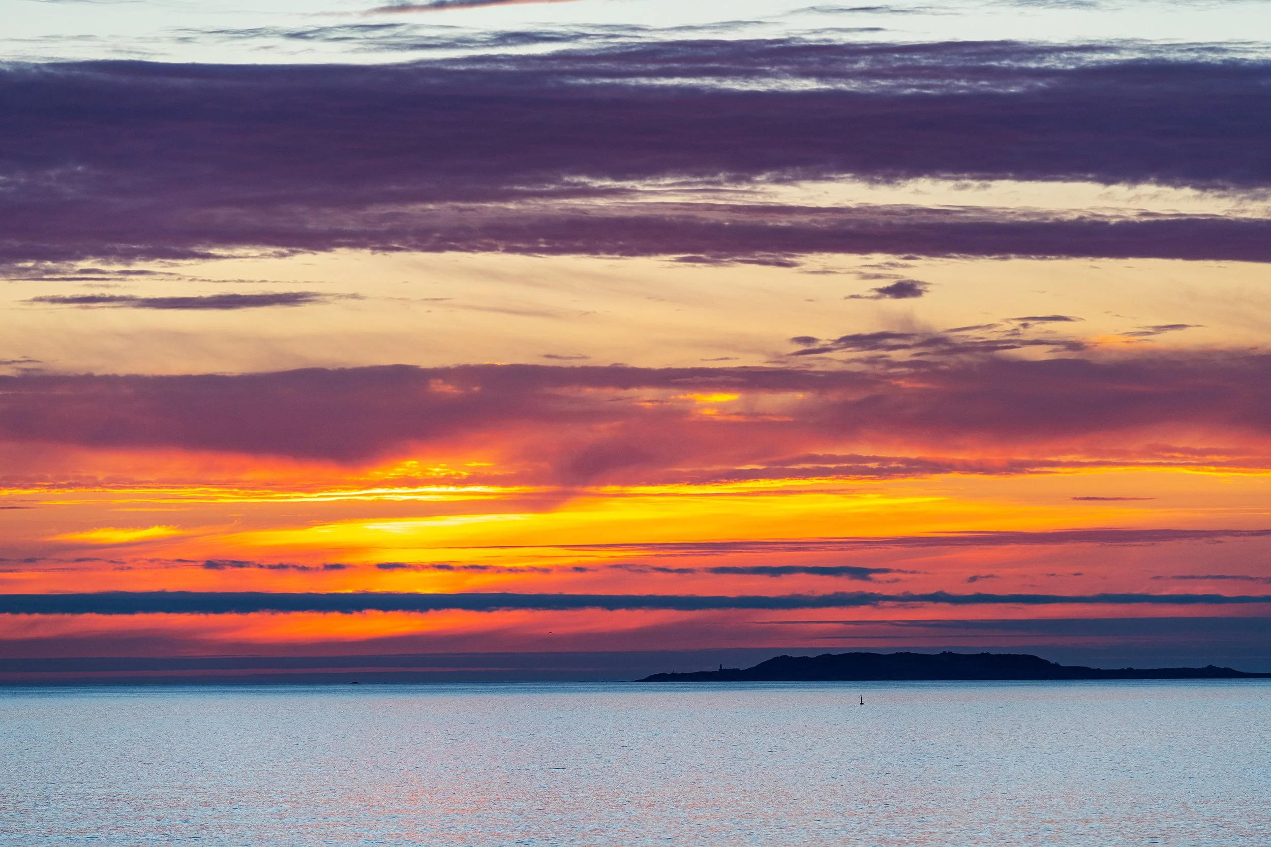 Silhouette of the Galician coast at the opening of the Ria de Pontevedra and the Ria de Arousa at dusk