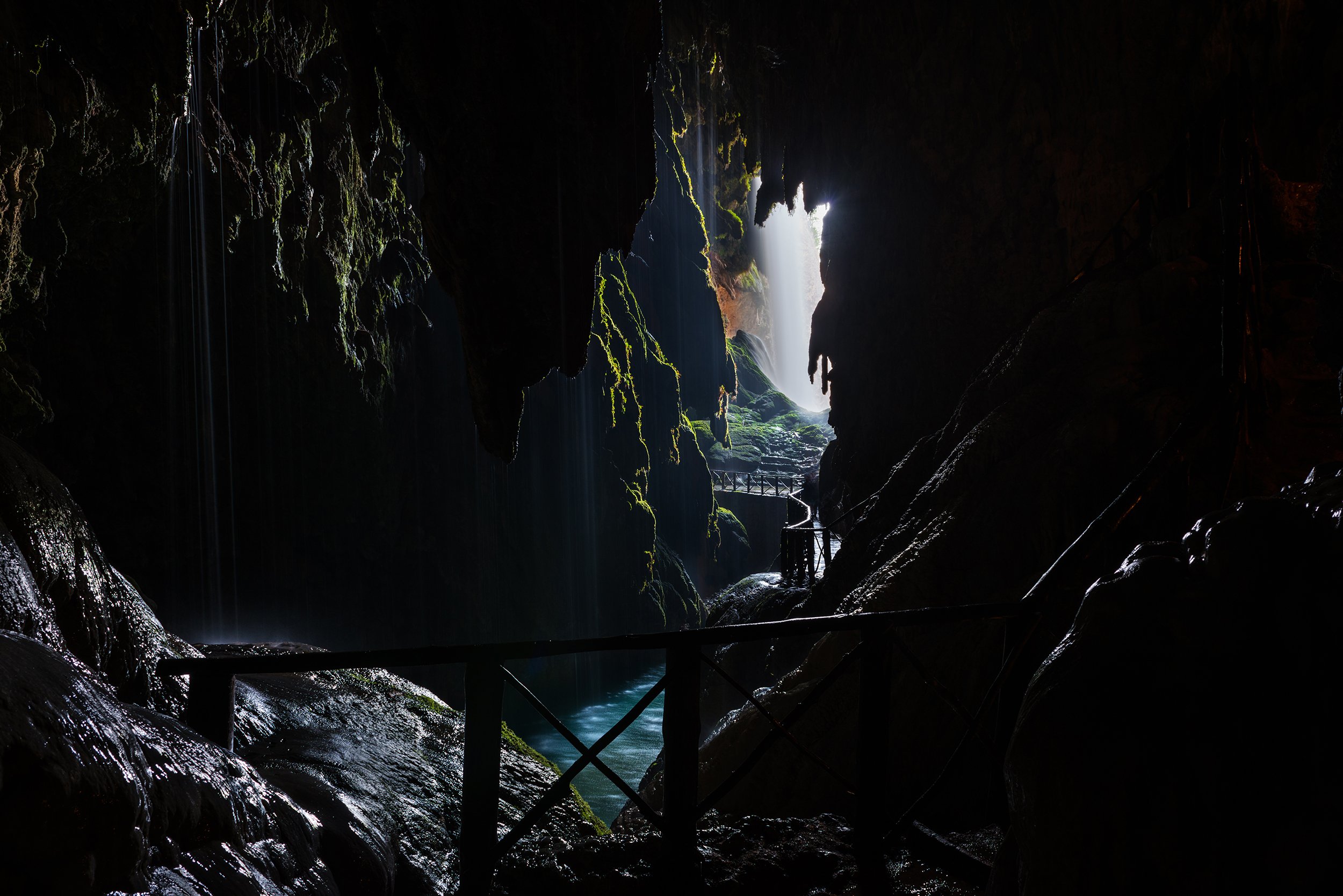 Path inside a cave leading to a waterfall on the Piedra River in Aragon, Spain.