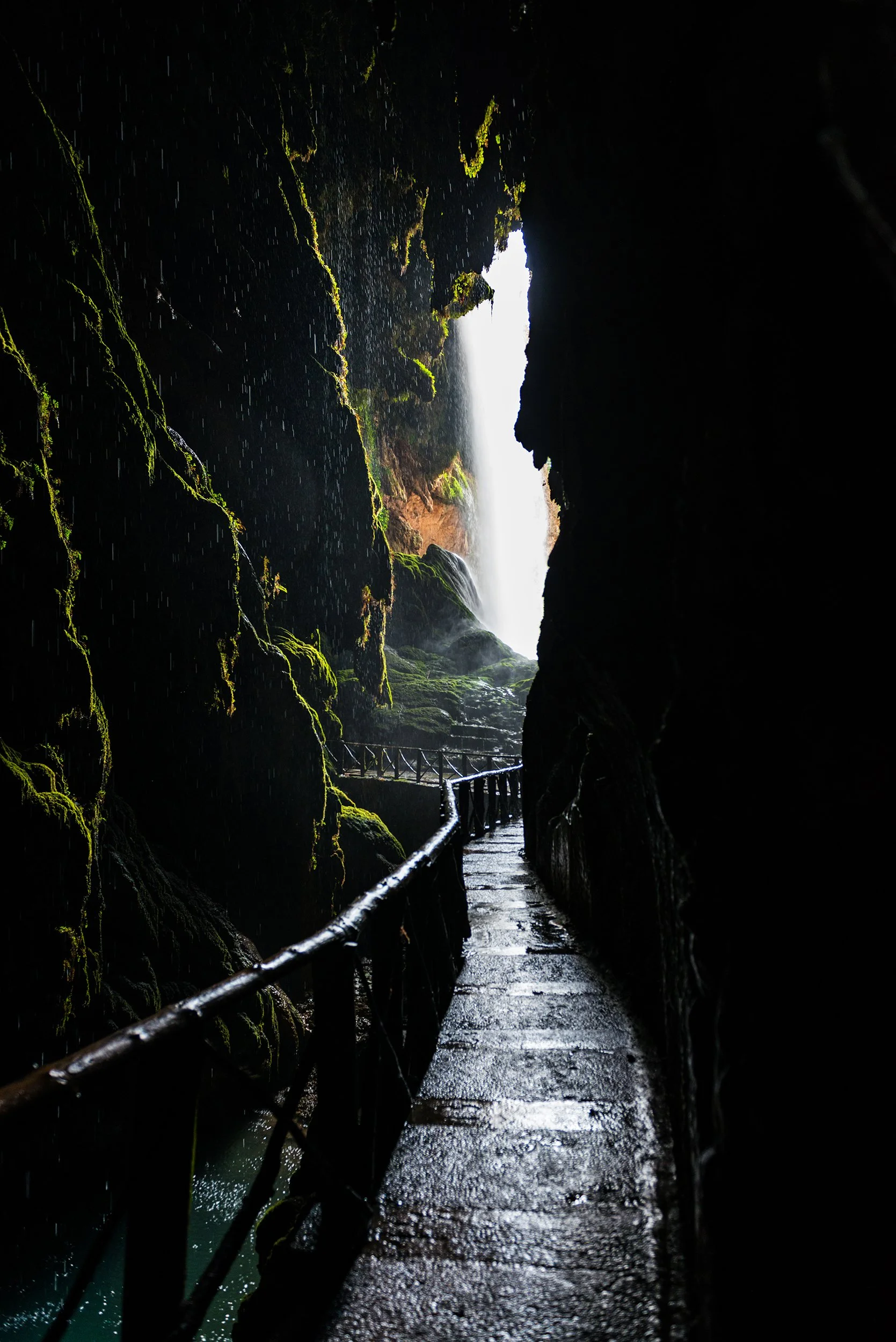 Path inside a cave leading to a waterfall on the Piedra River in Aragon, Spain.