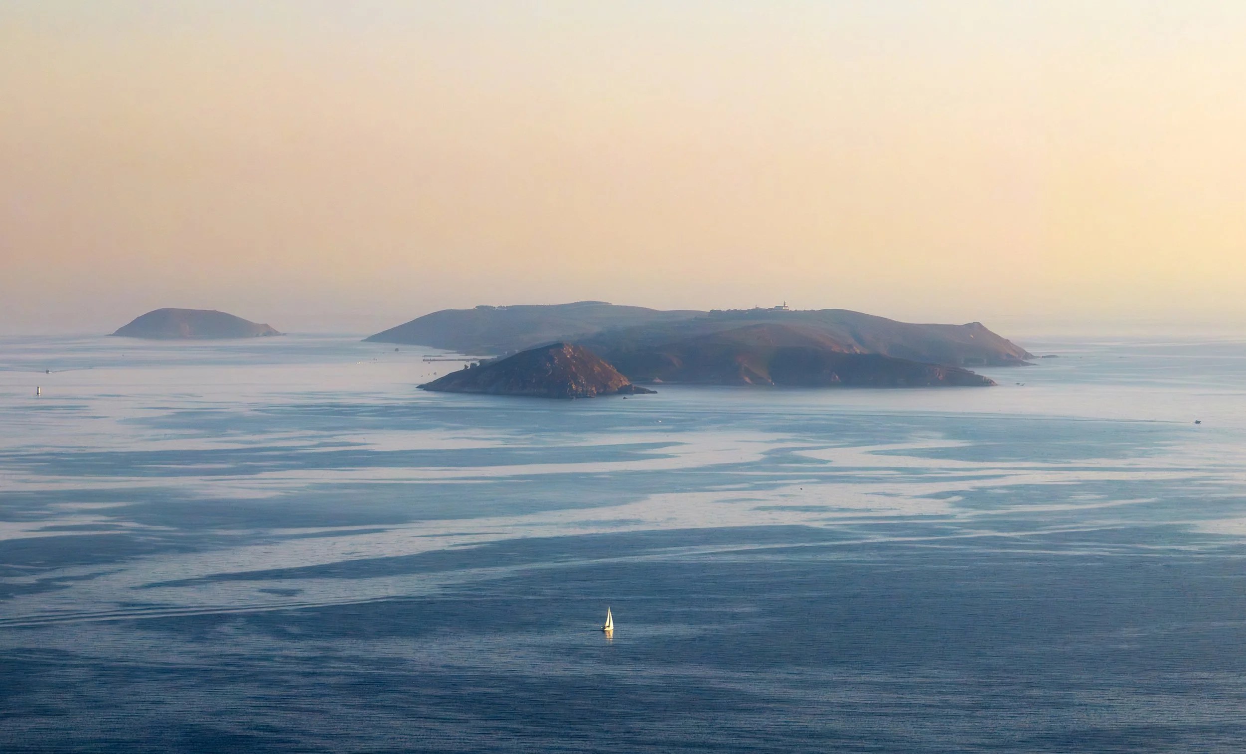 Sailboat and Ons Islands in Galicia at dusk, Spain