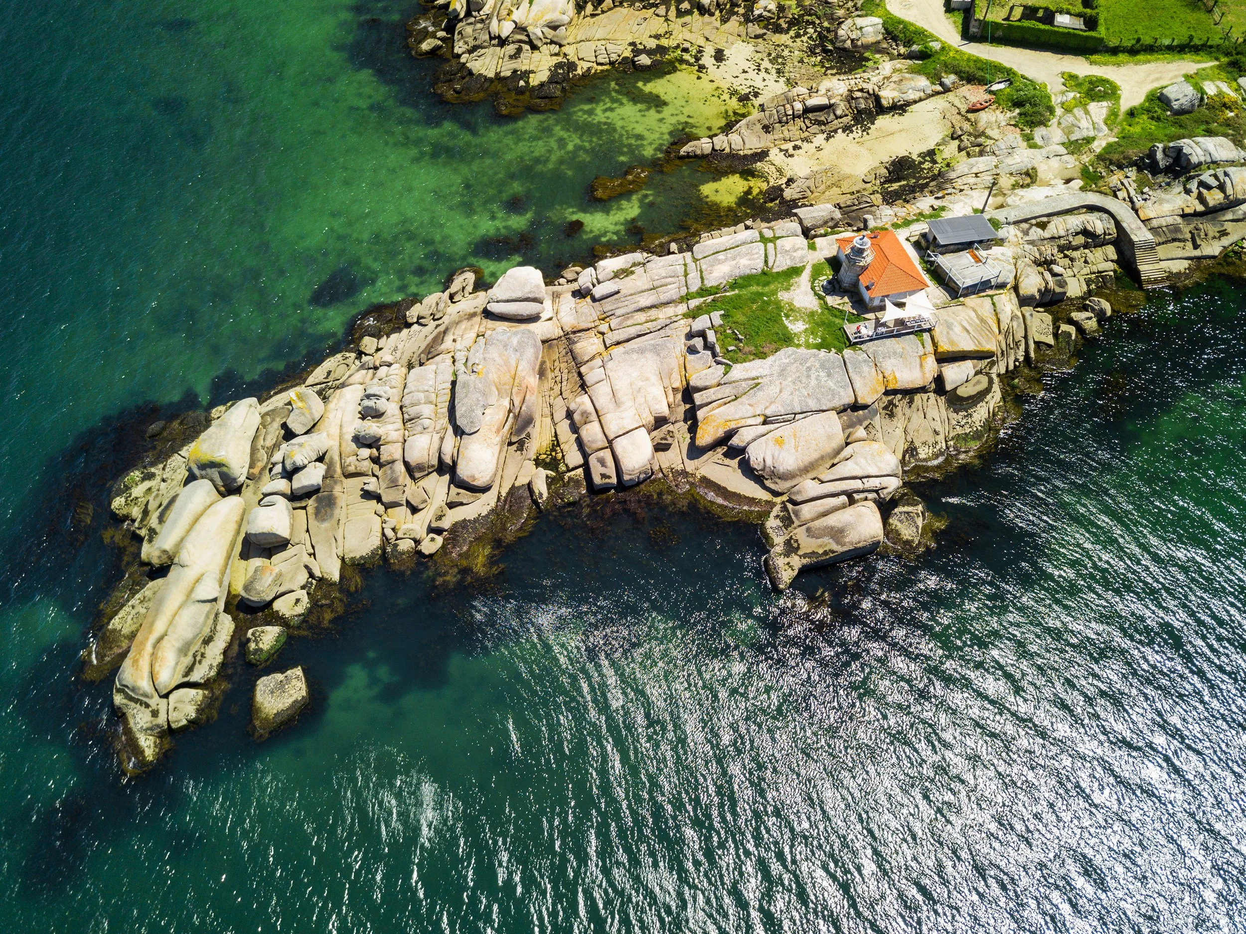 Aerial view of a small lighthouse in Galicia