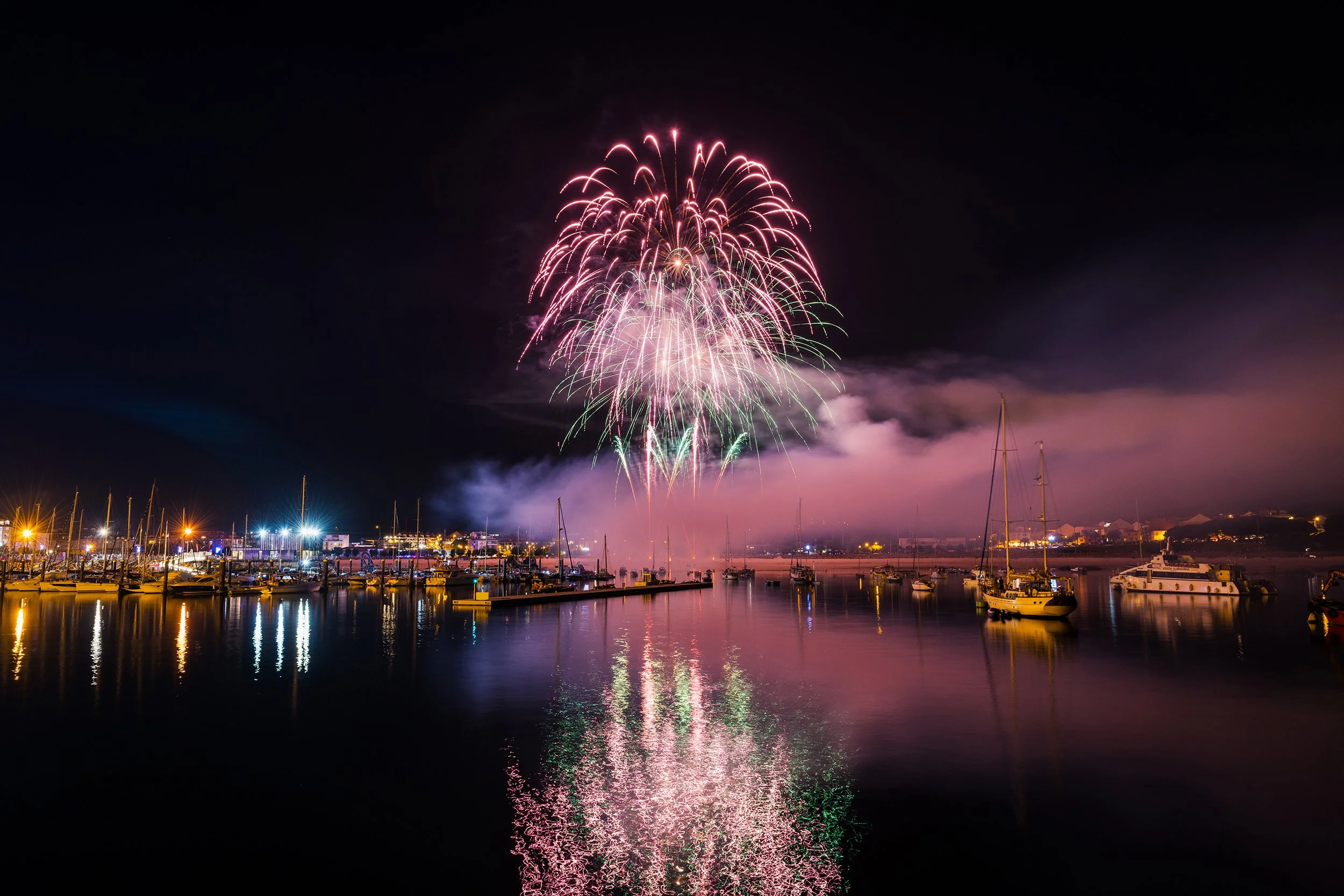 Colorful fireworks over sea in Galicia