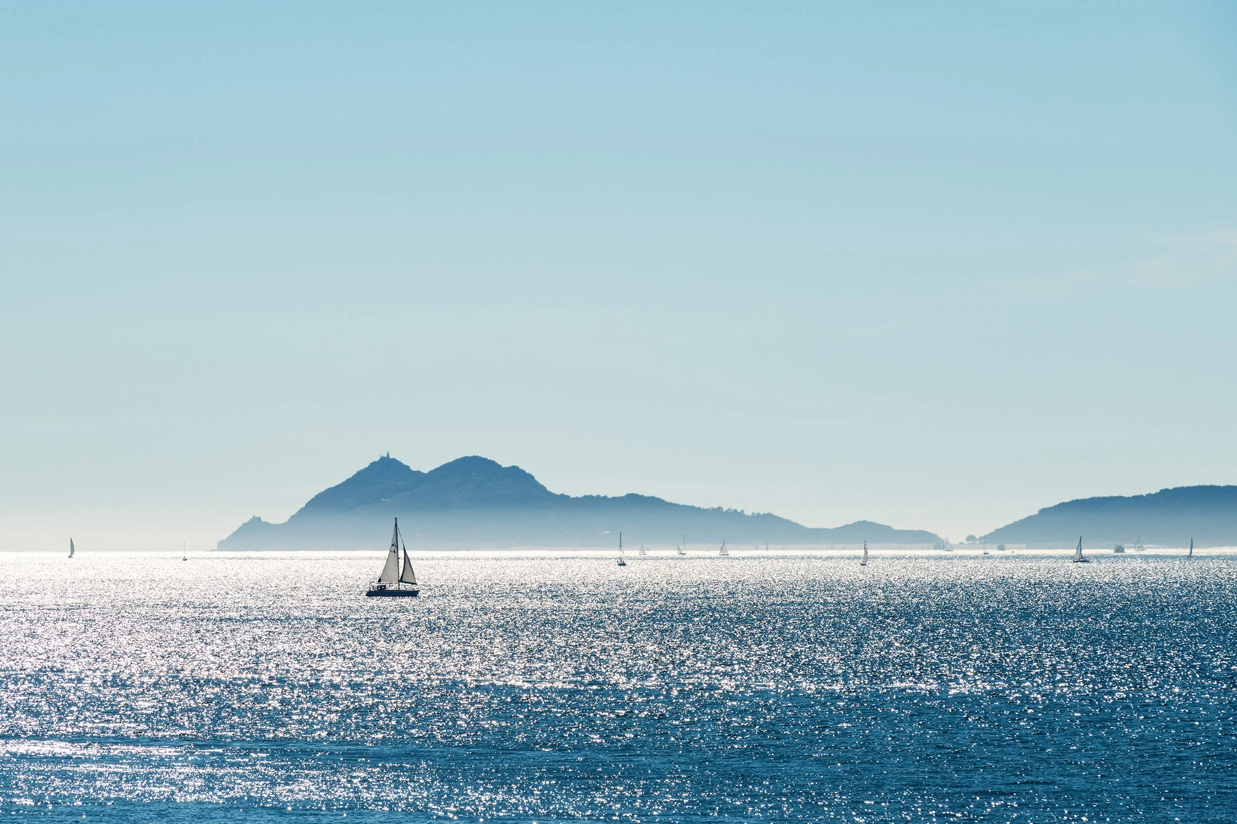 Ferry boat and Cies Islands in Galicia at dusk, Spain