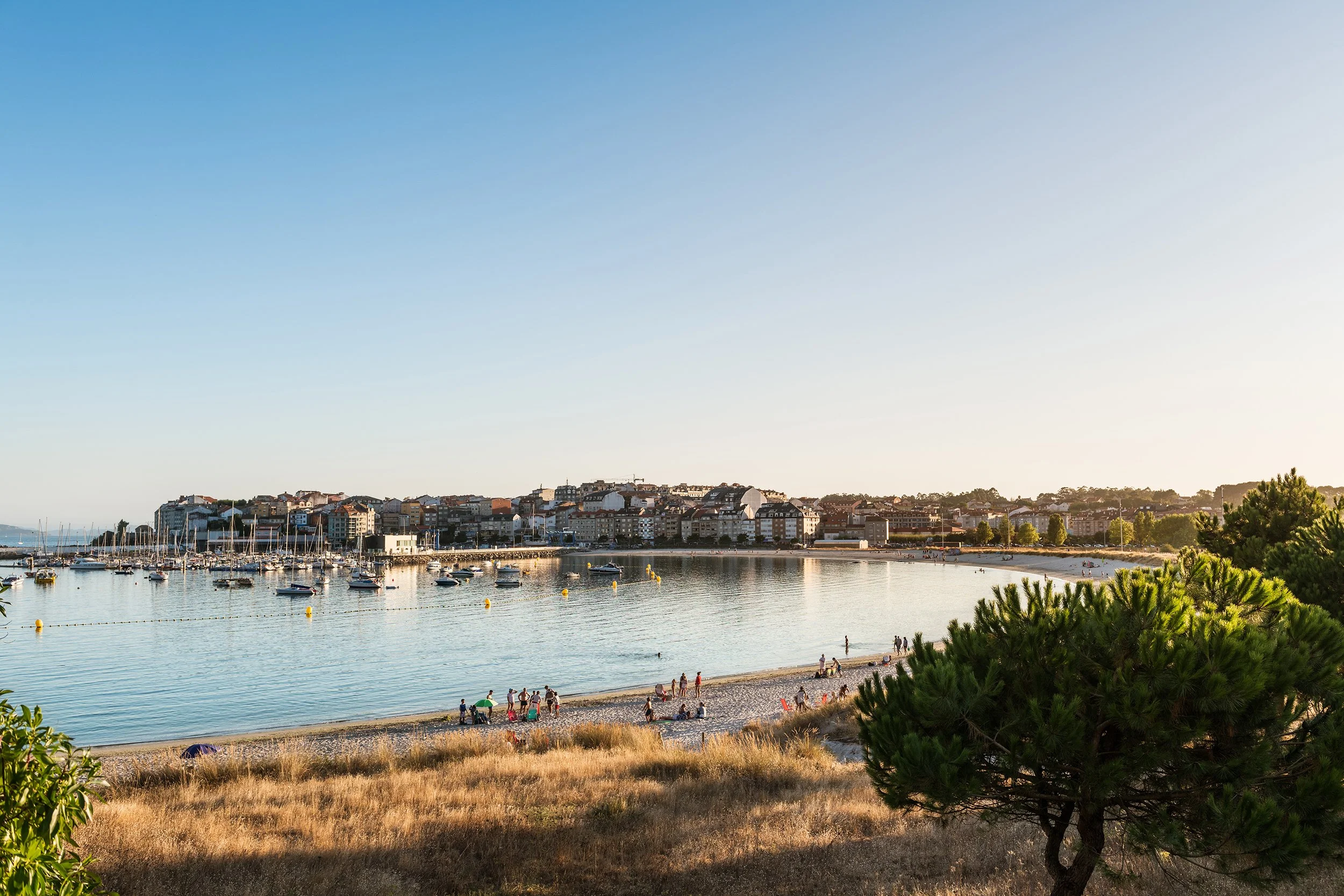 Beach and port of Portonovo in Galicia at dusk