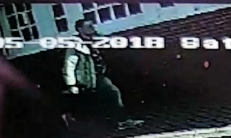 A CCTV image of the suspect - the man is described as white, aged in his twenties, between 5ft 6in and 5ft 8in, slim with dark hair and was wearing jeans and beige jacket. 
