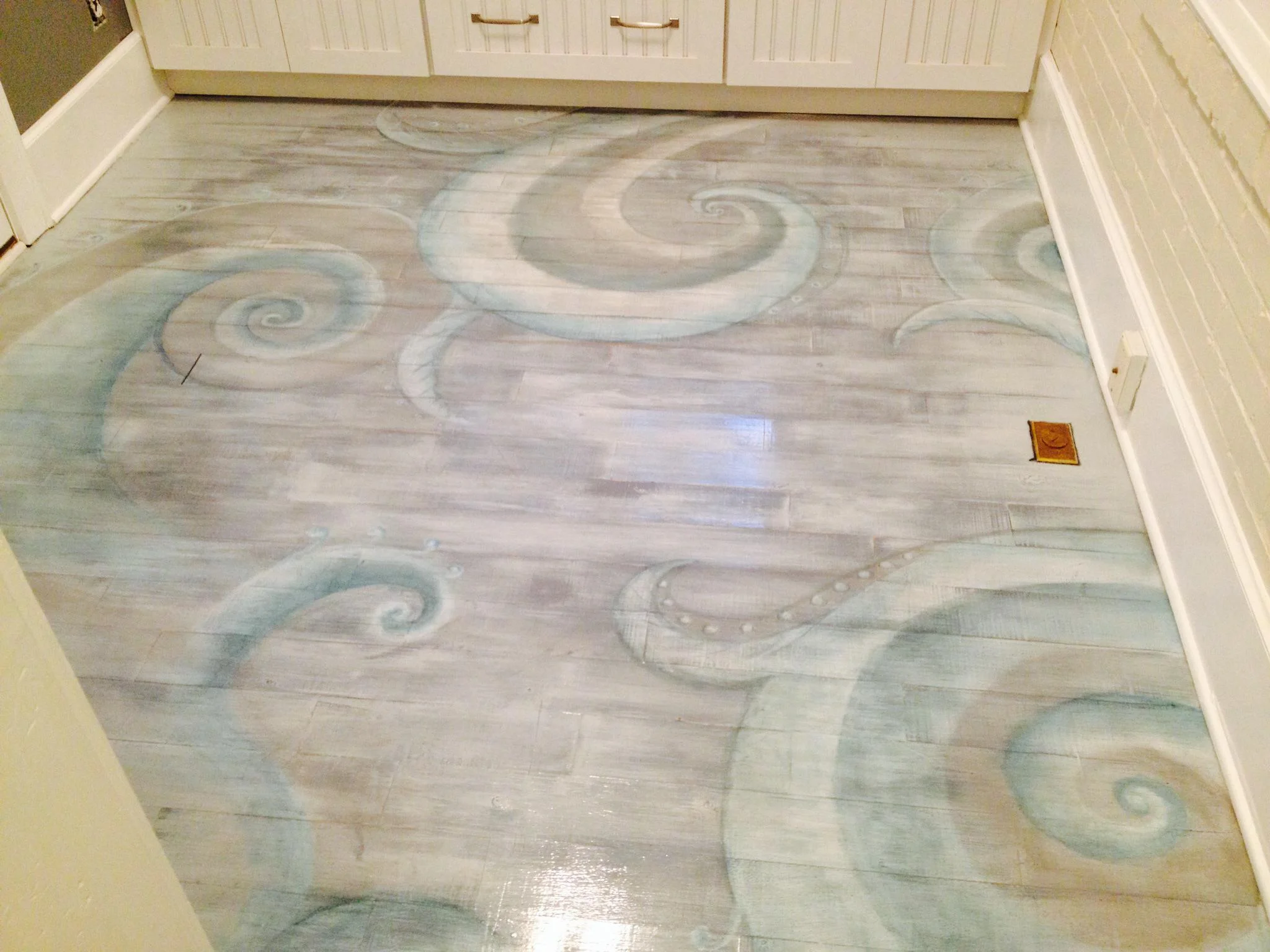 Painted design on antique wood floor