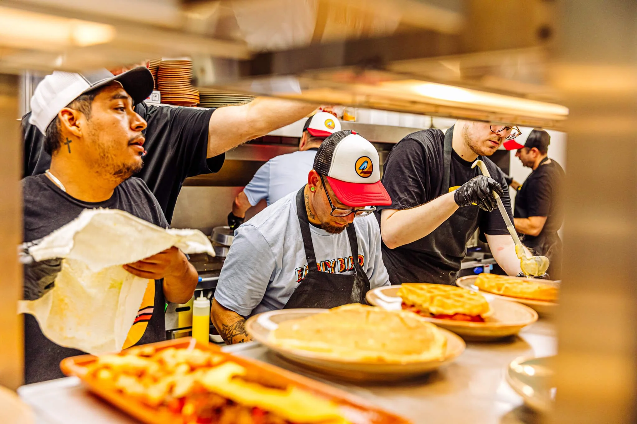 chefs at Early Bird prepping in the back kitchen