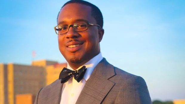 E. Carlos Tanner, III '03