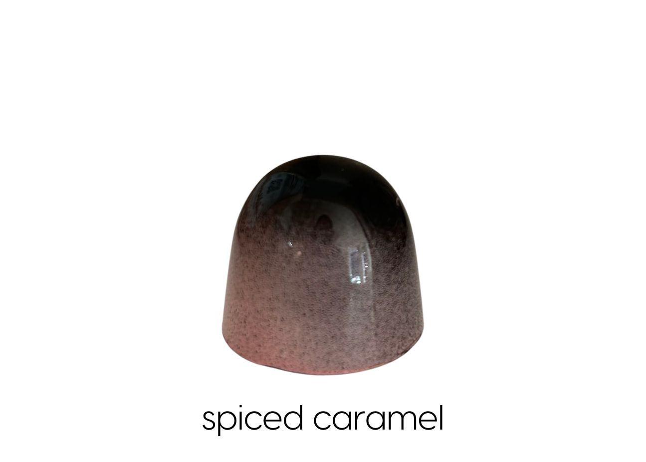 caramel infused with black cardamom, clove and cinnamon with blonde chocolate ganache in dark chocolate