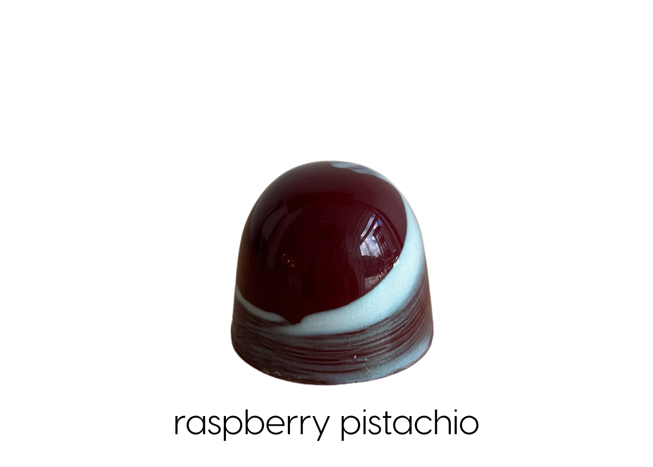 Raspberry pâte de fruit, raspberry ganache, pistachio ganache in milk chocolate