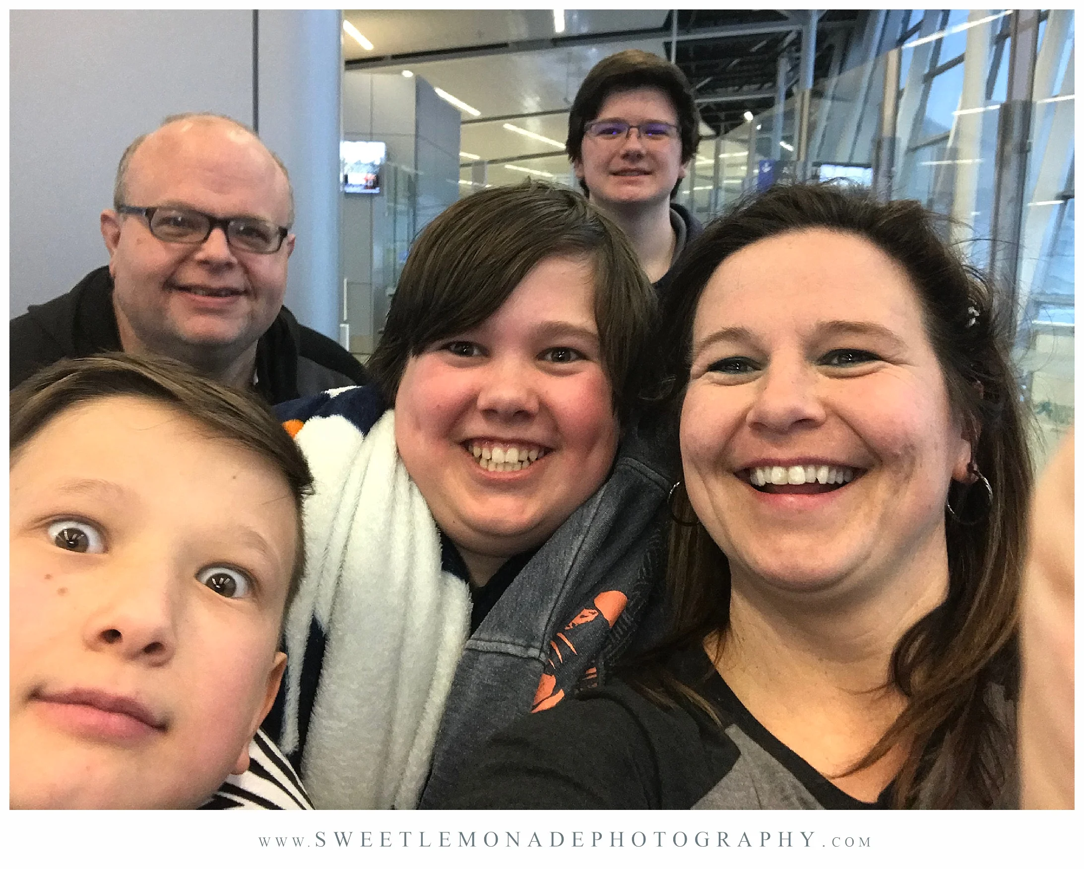 Cell selfie at the airport on our way to see our mom and grandma. 