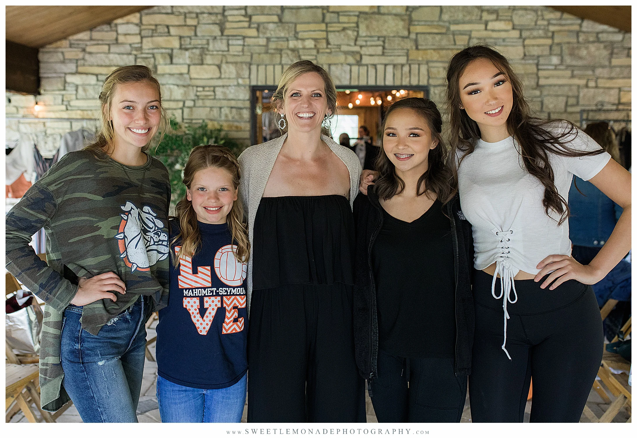 Owner of EnRoute Boutique Jennifer Wagner, center, with the fashion show models from L to R: Jessie, Kenna, Katie and Ashley.