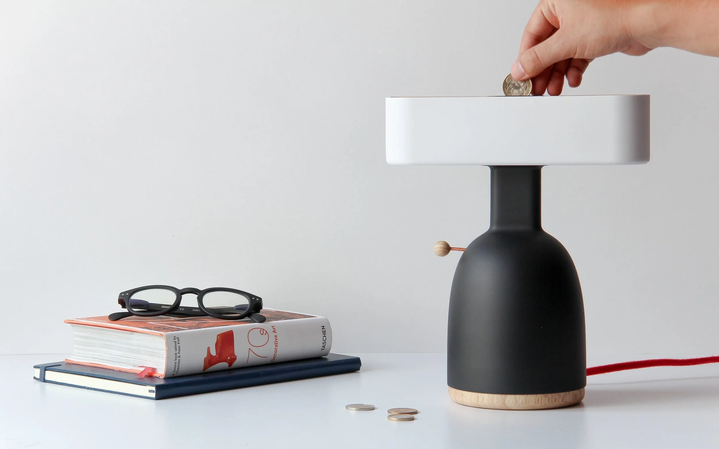 Dina is a conceptual but functional prototype, with a 3D printed body and shade, and top and bottom lids made from natural ash wood. Photo by Mauricio Sanin Mazuera.