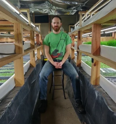 Sifted host alex trahan in his hydroponic greenhouse.jpg