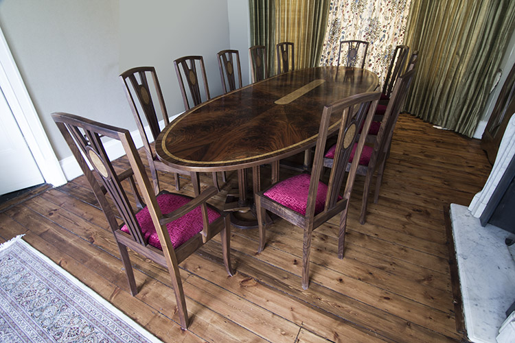 Extending oval table in Walnut