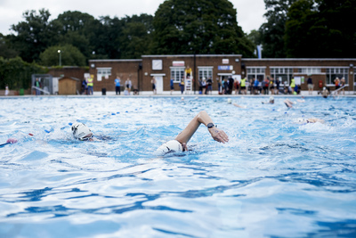  People swimming in Brockwell lido at aquathlon 