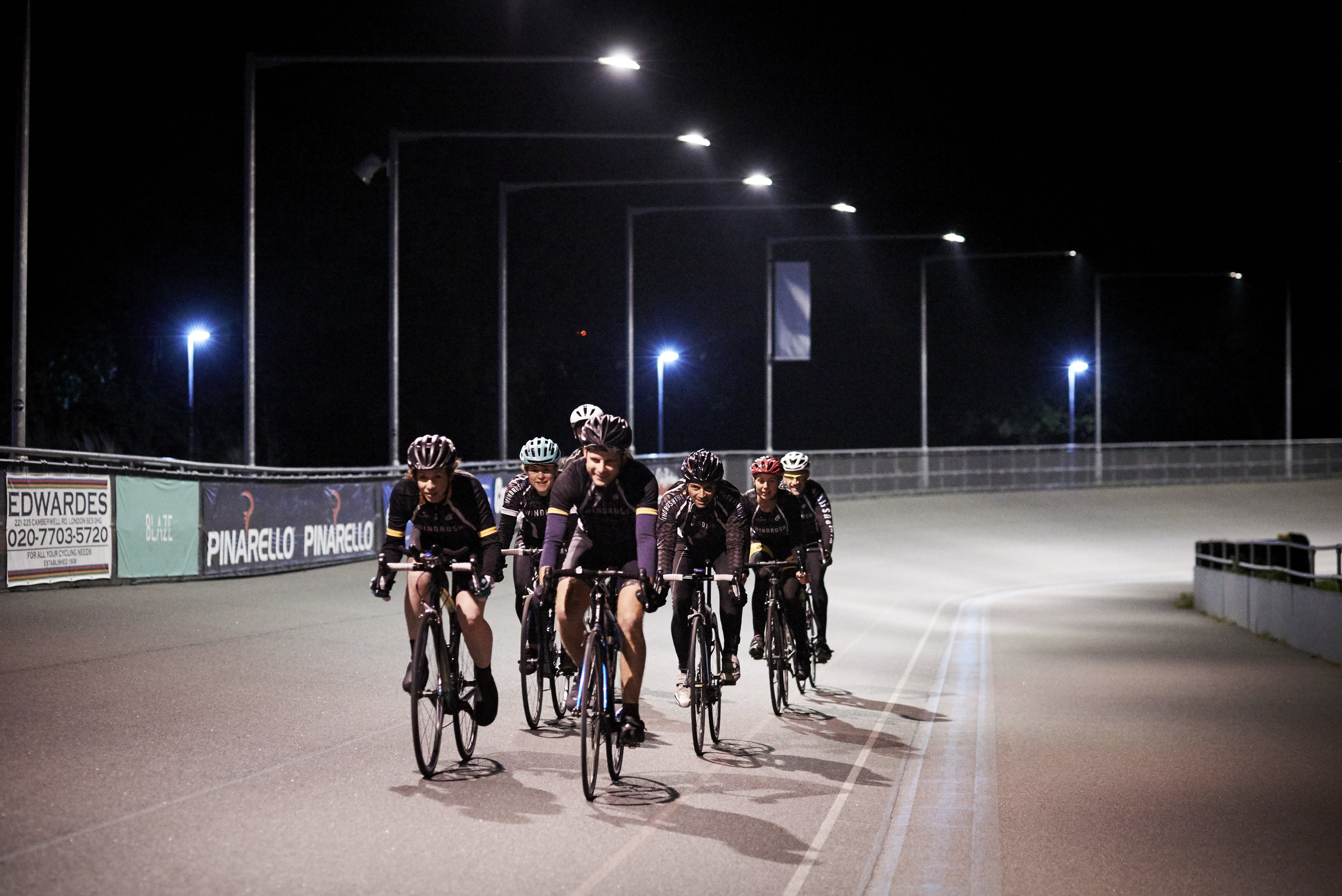 Group cycling in a peloton at Herne Hill Velodrome