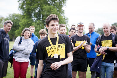  Group of people wearing windrush aquathlon tshirts and medals 