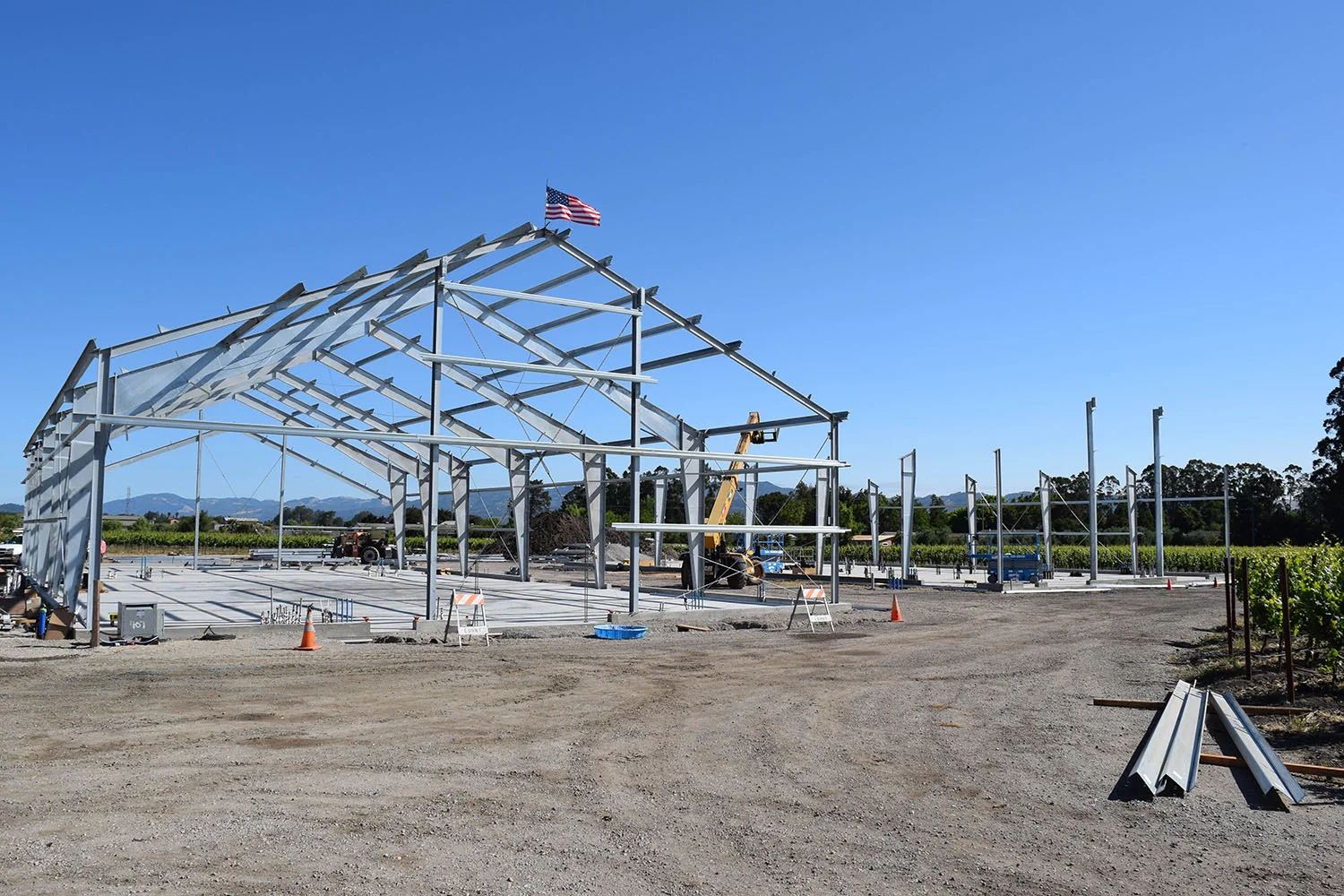 As is tradition with this erecting crew, with the placement of the first beam representing the top of the building, also is the placement of the American Flag. This flag has special meaning for this team, as this was one of the team members Grandfather’s flag, who was also a steel erector. This flag now flies with the 3rd generation of this steel erecting family.