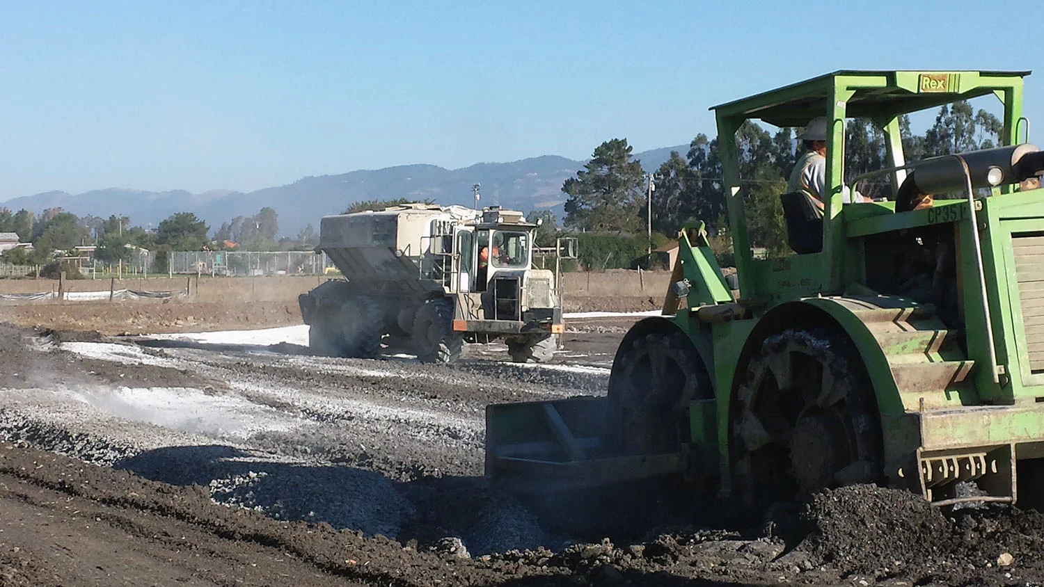 Depositing the calcium hydroxide to be mixed into these Carneros soils to allow for soil compaction