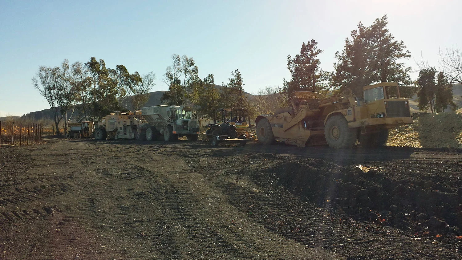 The heavy equipment at rest as the site is prepared for final compaction