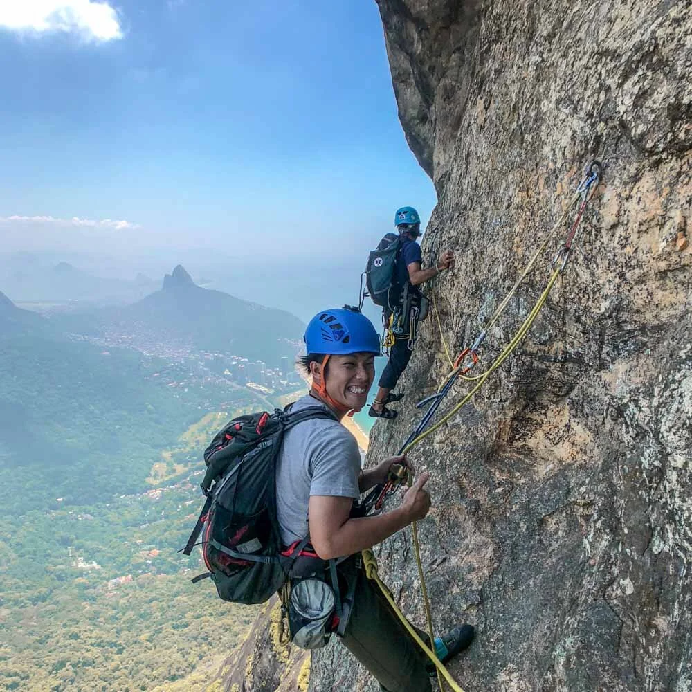 Rock climber on the route Passagem dos Olhos on Pedra da Gavea in Rio de Janeiro, Brazil