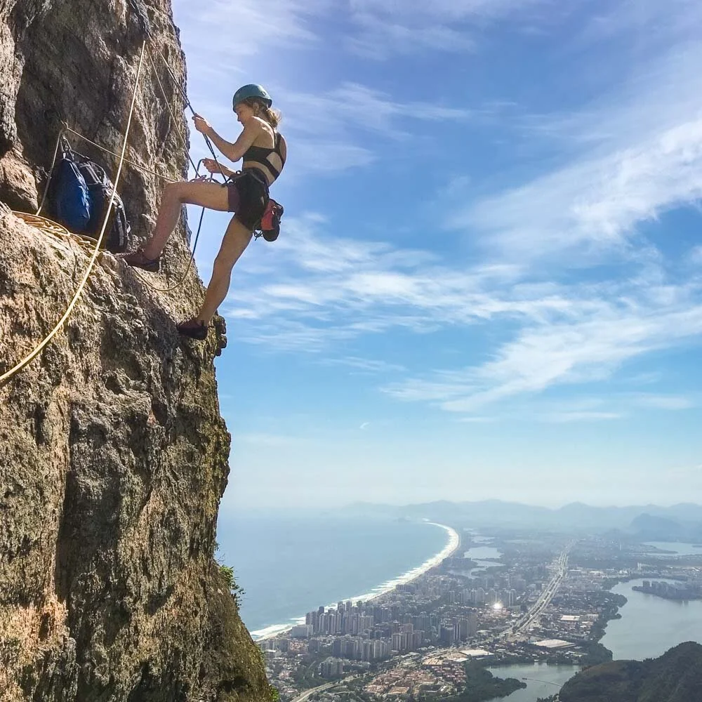Climber at the second belay station on the route Passagem dos Olhos