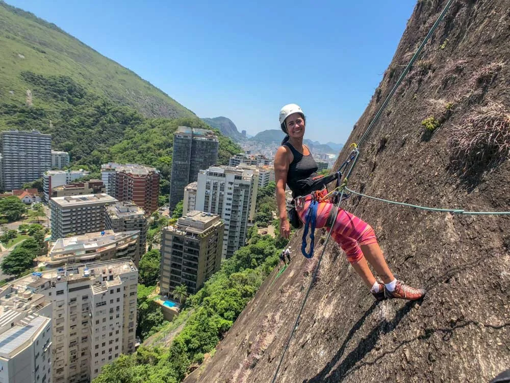 Girl rappelling the route Brilho da Noite on Morro do Cantagalo