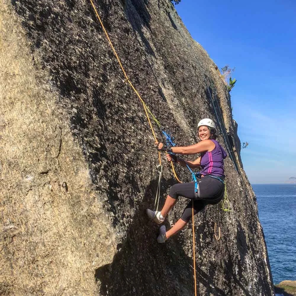 Girl practicing self-rescue methods in rock climbing