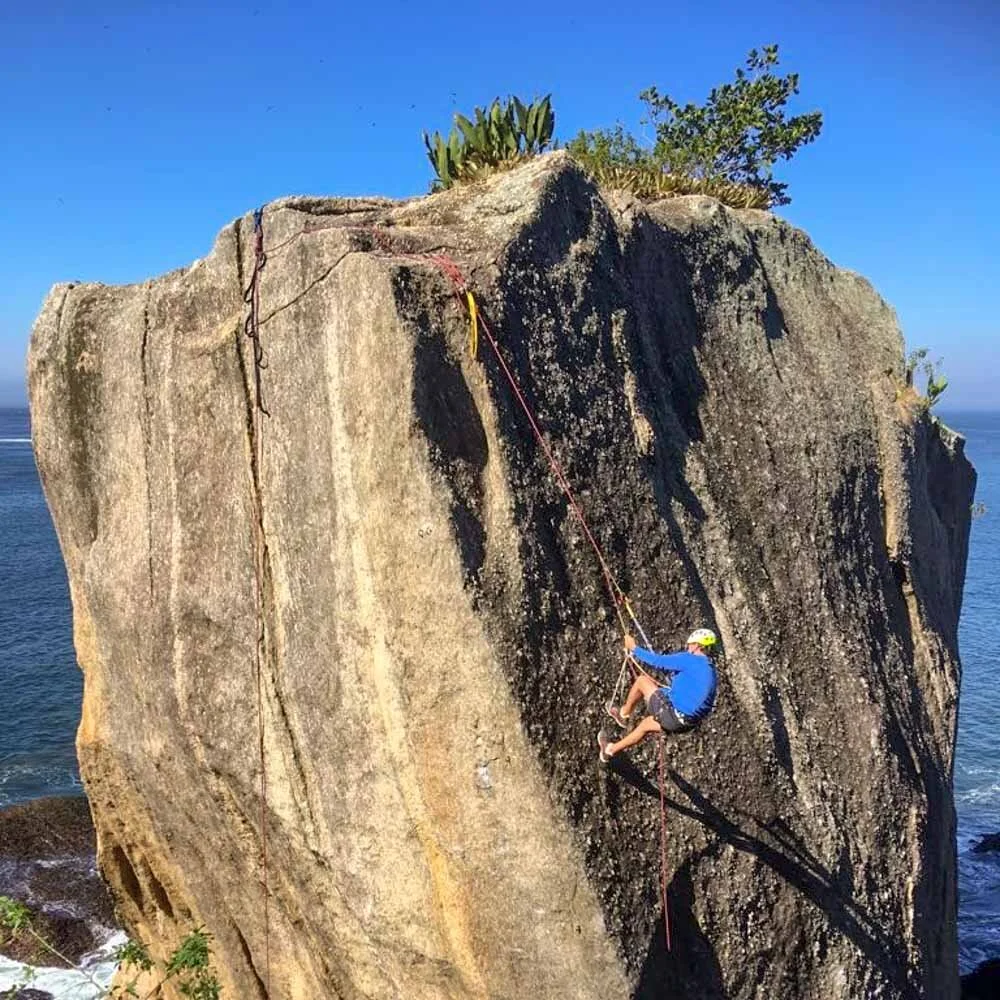 Man using prusik knots to ascend a rope