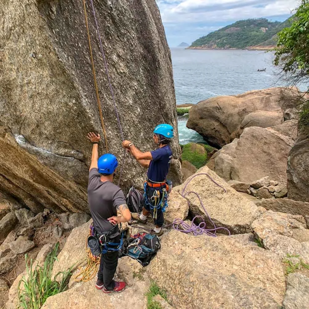 Two climbers setting up for practice of self-rescue methods