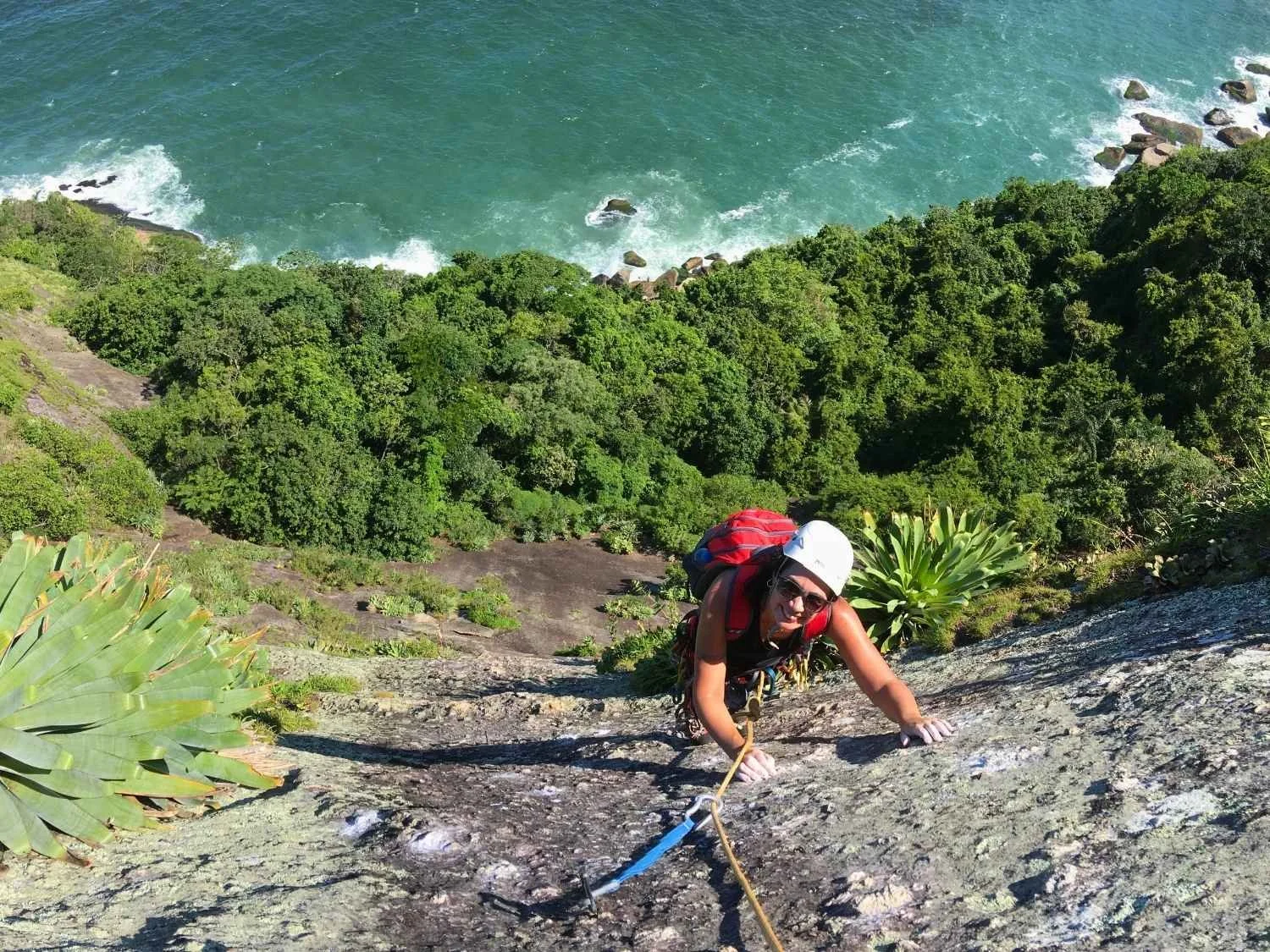 Climber on the last pitch of the route Coringa on Sugarloaf Mountain in Rio de Janeior