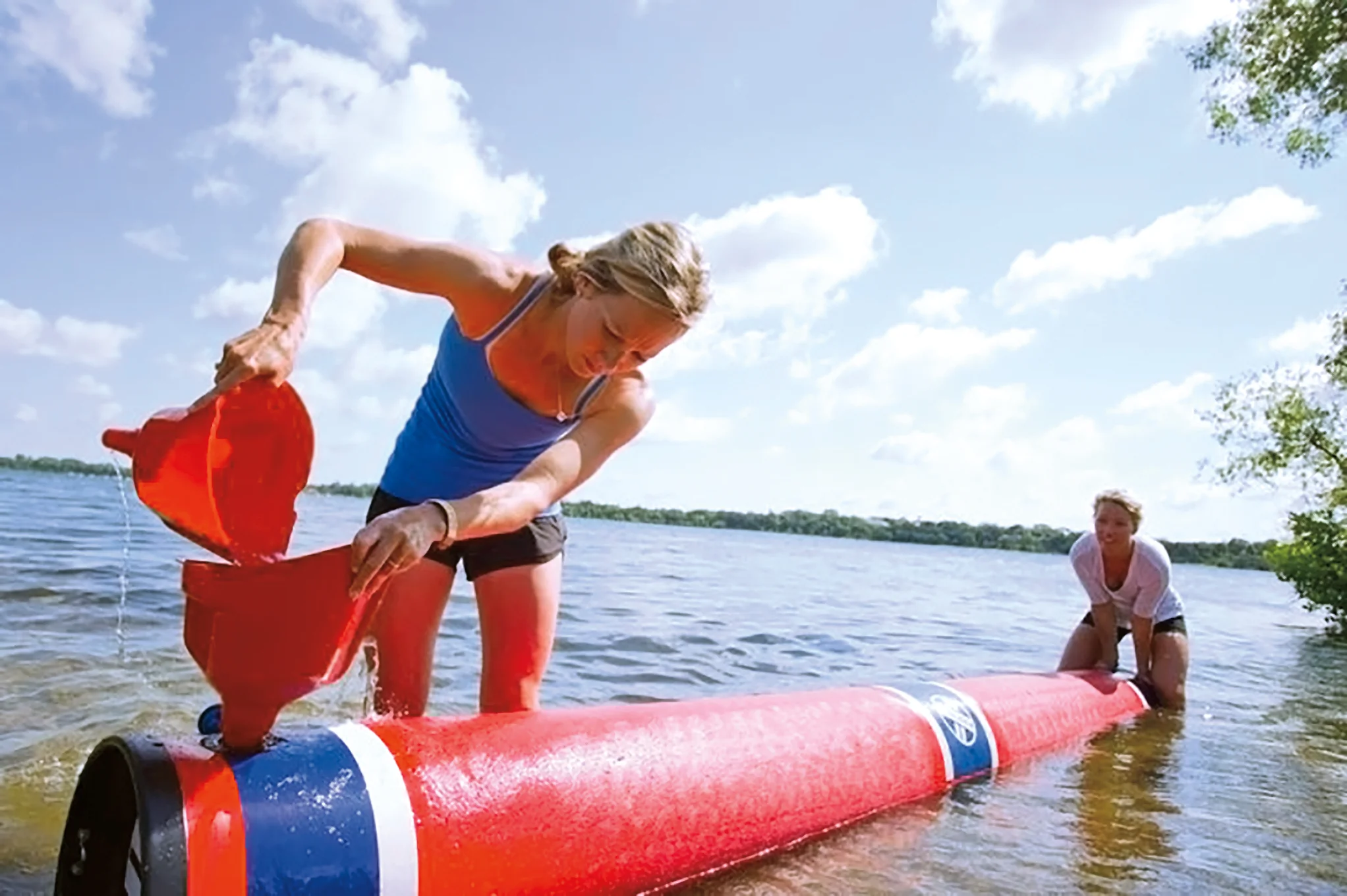 Photos| Andy King - Elizabeth Horvitz, Abby's sister, fills the Key Log’s innovative core, which is designed to make the synthetic version float and spin like a real log. When the core is emptied, the Key Log reverts to its 65-pound weight, making it portable. 