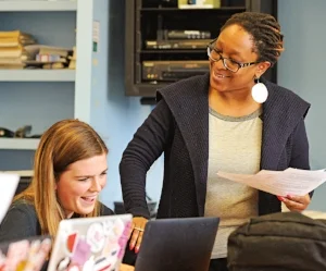 Mashadi Matabane (r.) guides students in her role as associate dean for equity and inclusion.