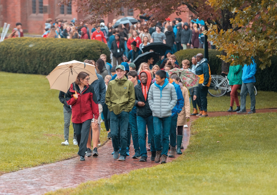 Richards (l.) leads new community members on the Cricket Walk.