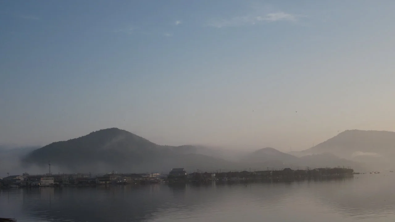 Fog rises over damaged parts of Ishinomaki