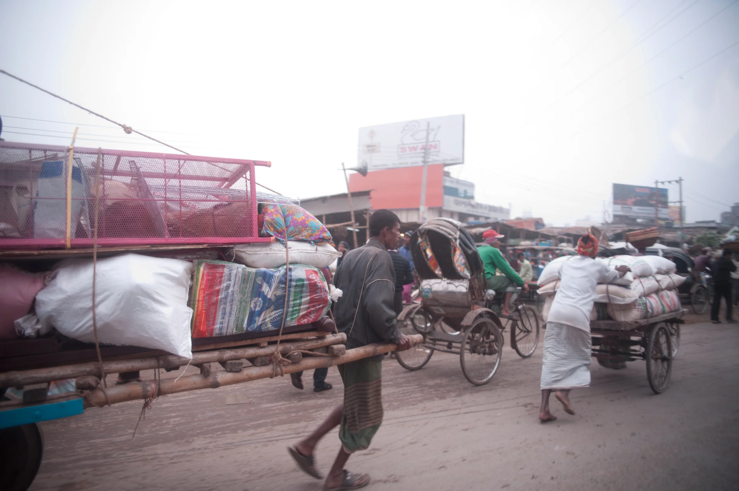 Taking goods to market in Dhaka. Photo by Shinobu Suzuki.