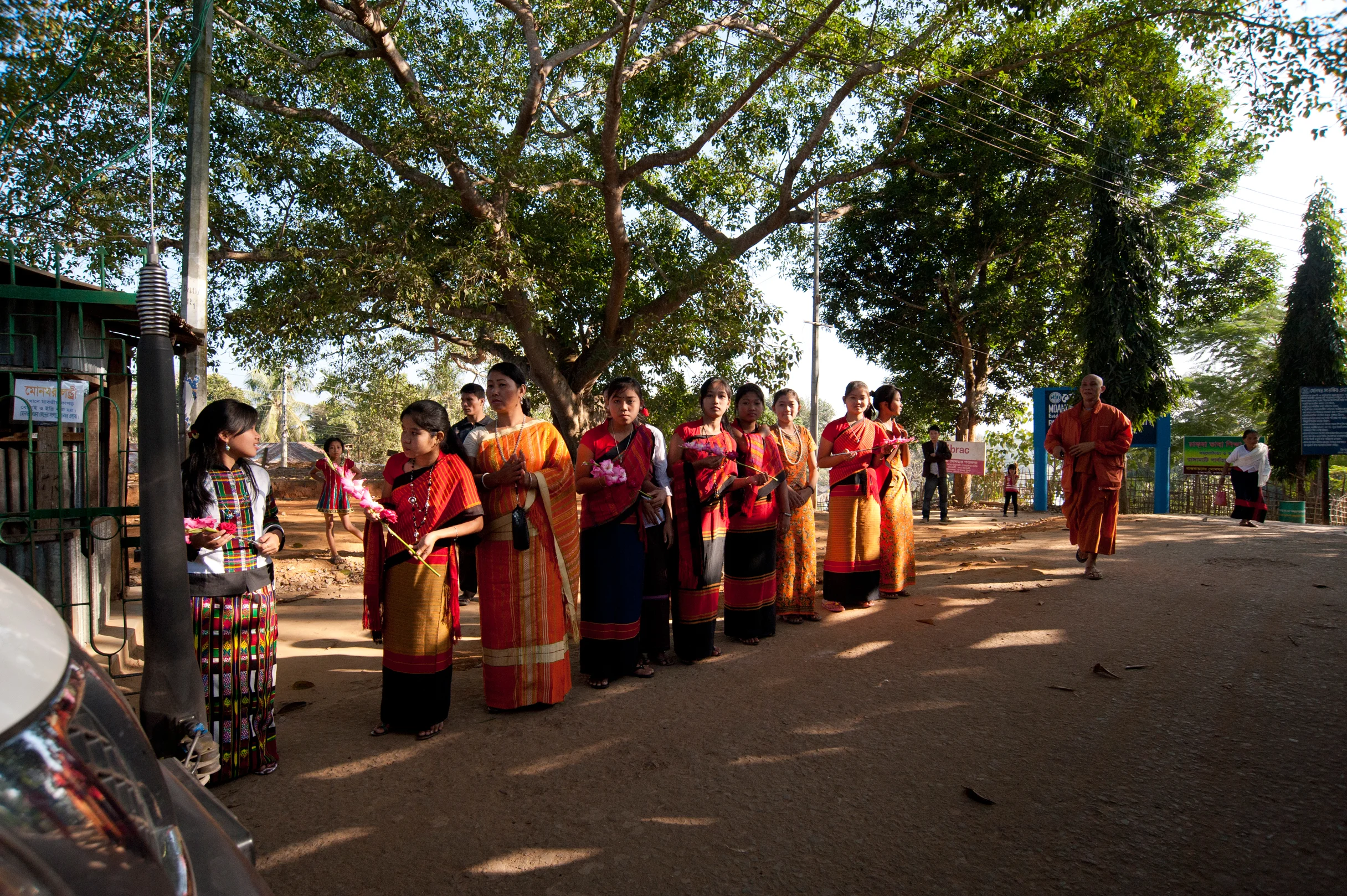 A colorful welcome – students of Moanoghar await our arrival, wearing traditional Chakma (and other tribal) attire. Photo by Shinobu Suzuki.