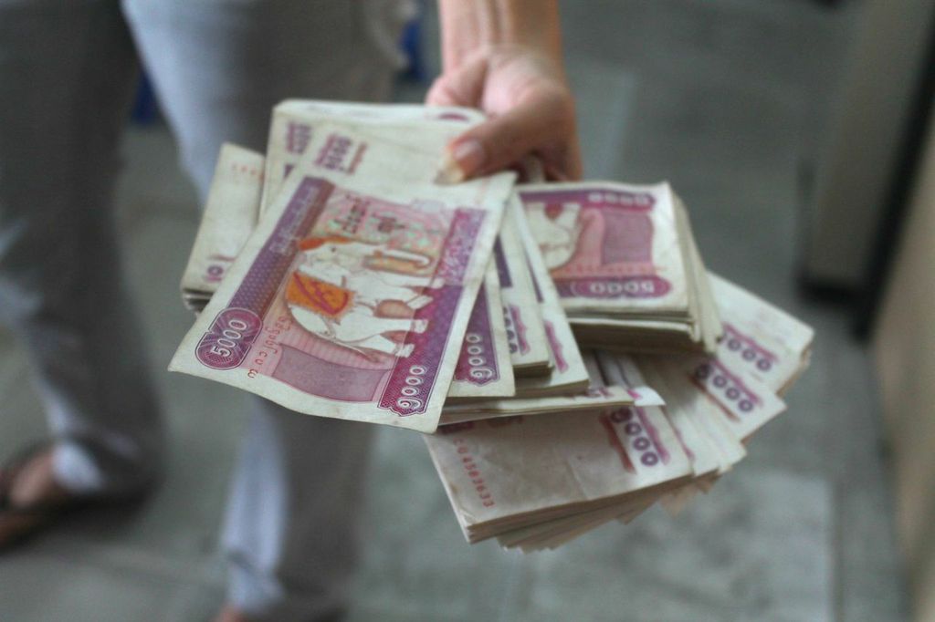 Bricks of cash. At the time of writing, the largest denomination of kyat, Myanmar's currency, was equivalent to around $5. This pile of money was used to buy a few domestic plane tickets.