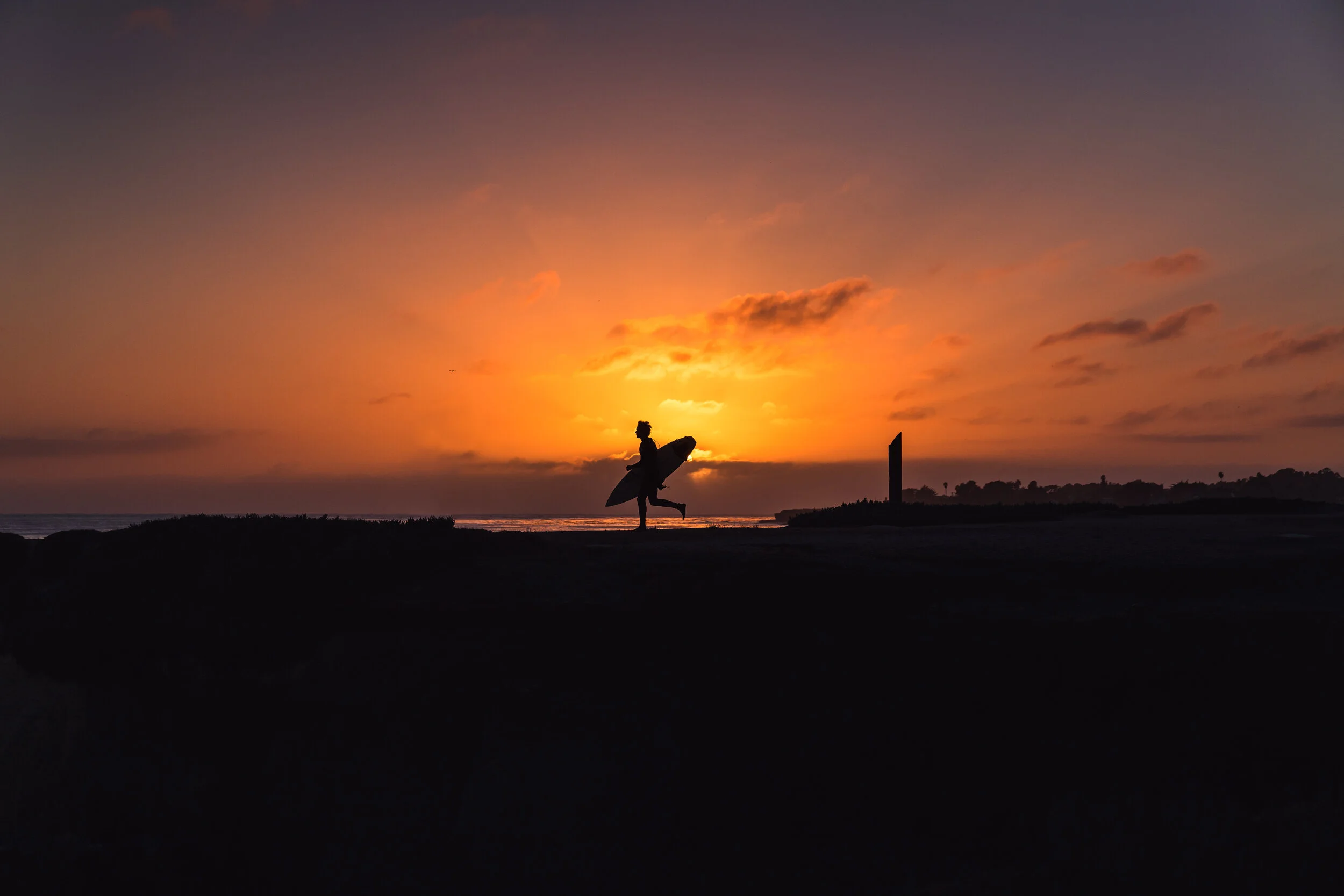 Steamer Lane Surfer Running landscape (1 of 1).jpg