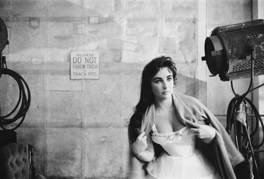 Elizabeth Taylor tries to keep warm on the set for Raintree County, 1965