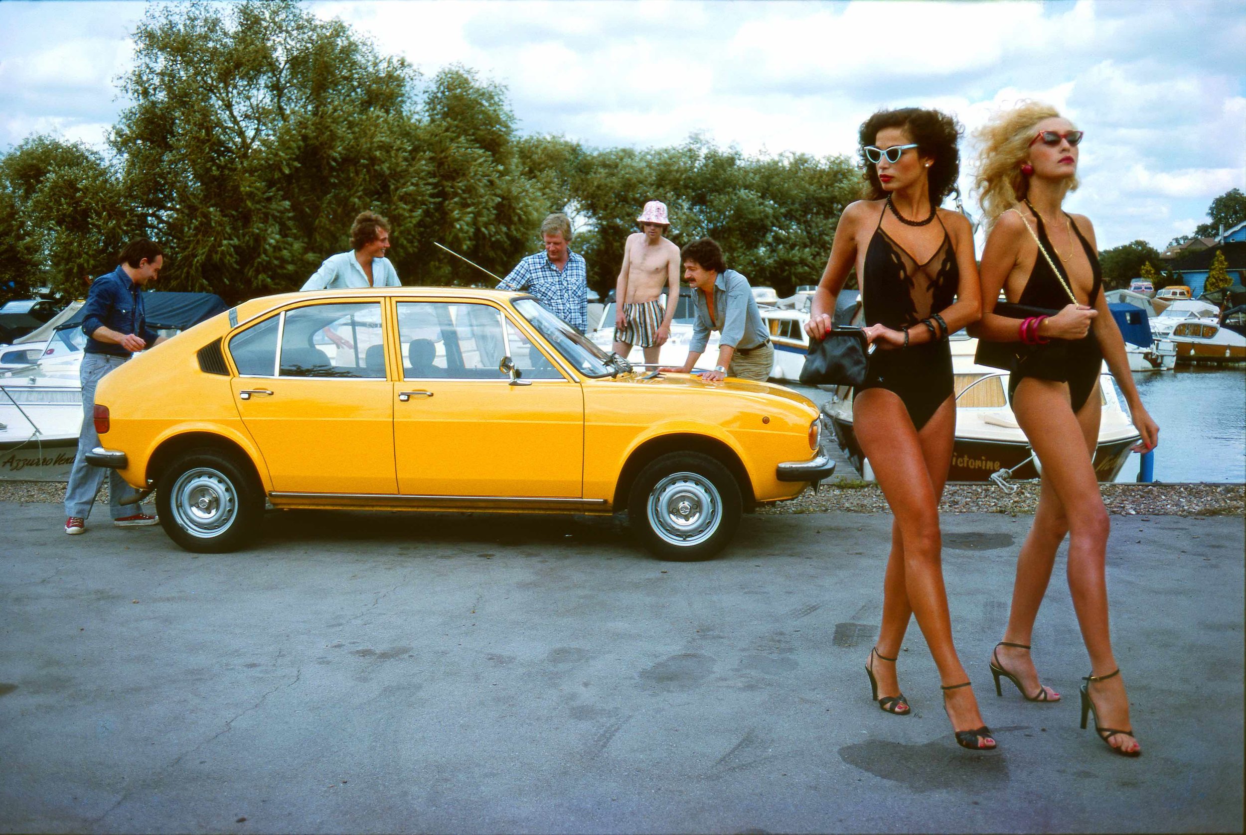 Jerry Hall, (possibly Bianca Jagger) & an Alpha Sud, Henley on Thames, Fashion Shoot for the Telegraph Magazine, 1974