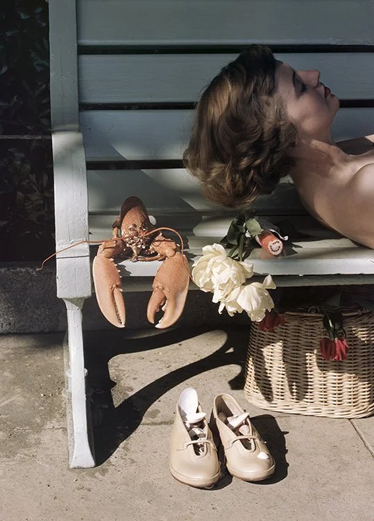 Georgina Morris with a Harvey Nichols’ fisherman’s creel basket and shoes by Brevitt at Pines. Photographed in Brighton for the cover of British Vogue, July 1949