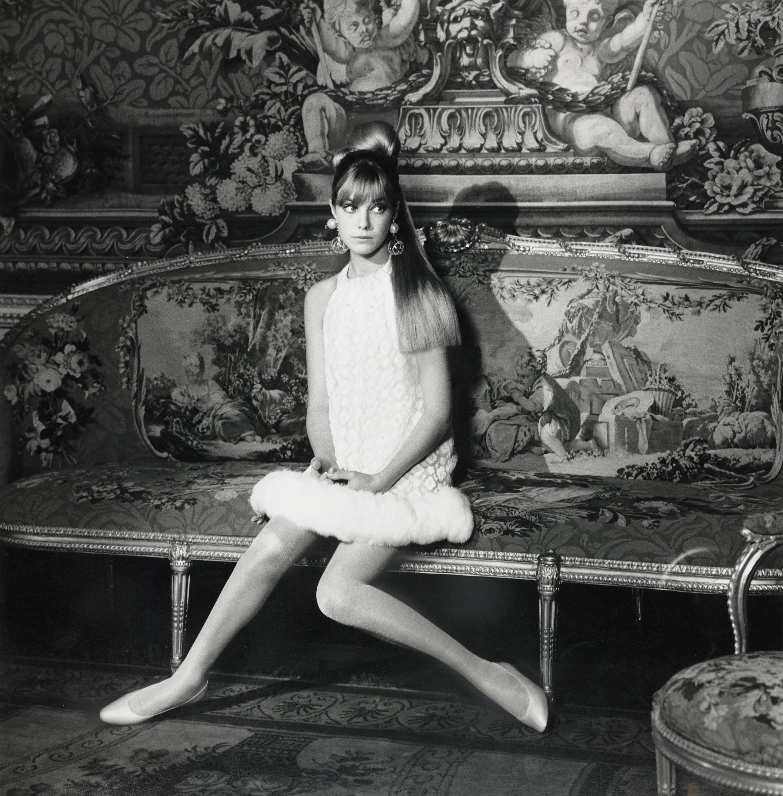 Jane Birkin wearing a white chiffon dinner dress by John Bates. American Vogue, 1 August 1966 by Norman Parkinson