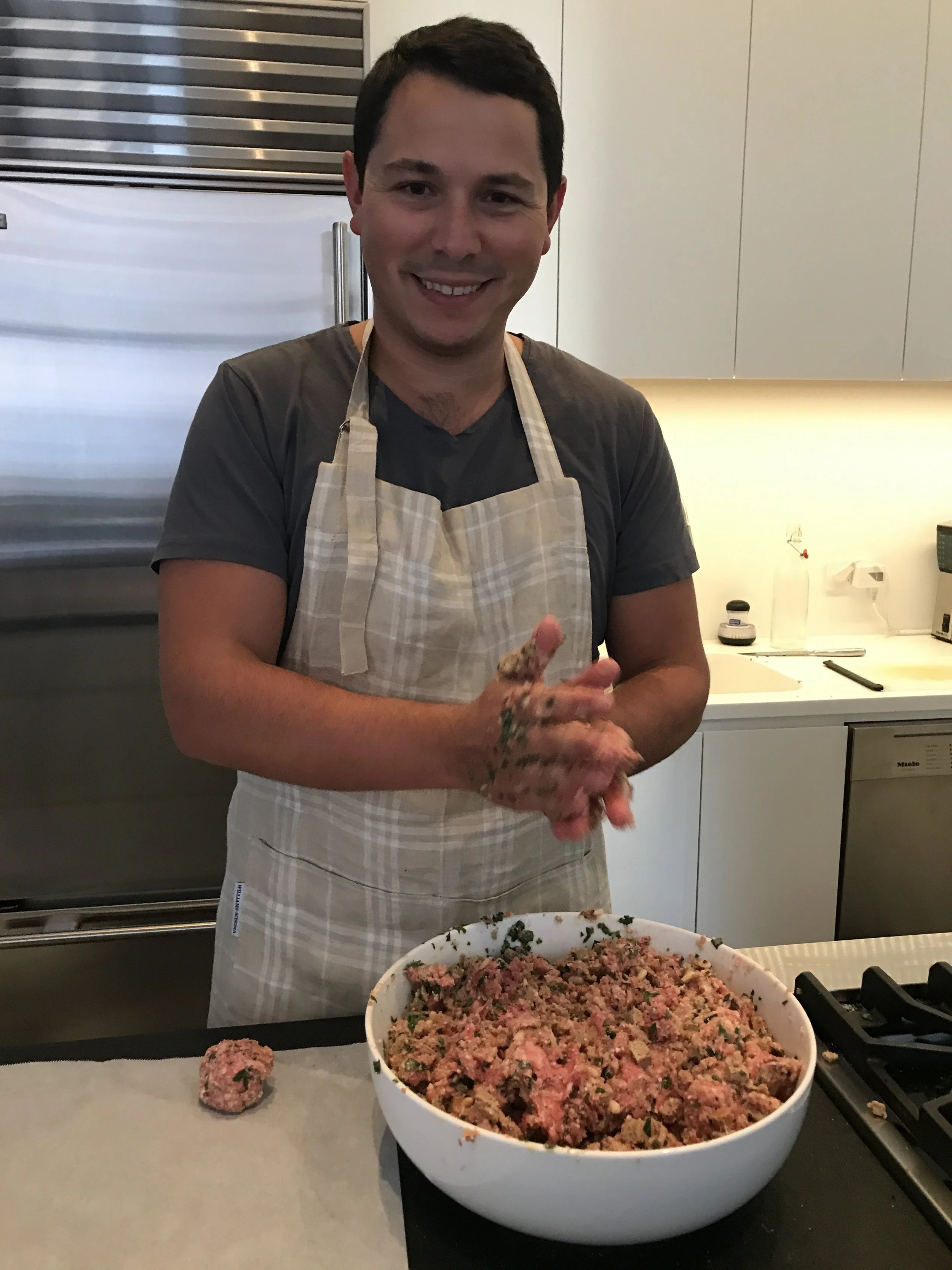 There's John with half of our meatball batch, making the first of 97 meatballs!